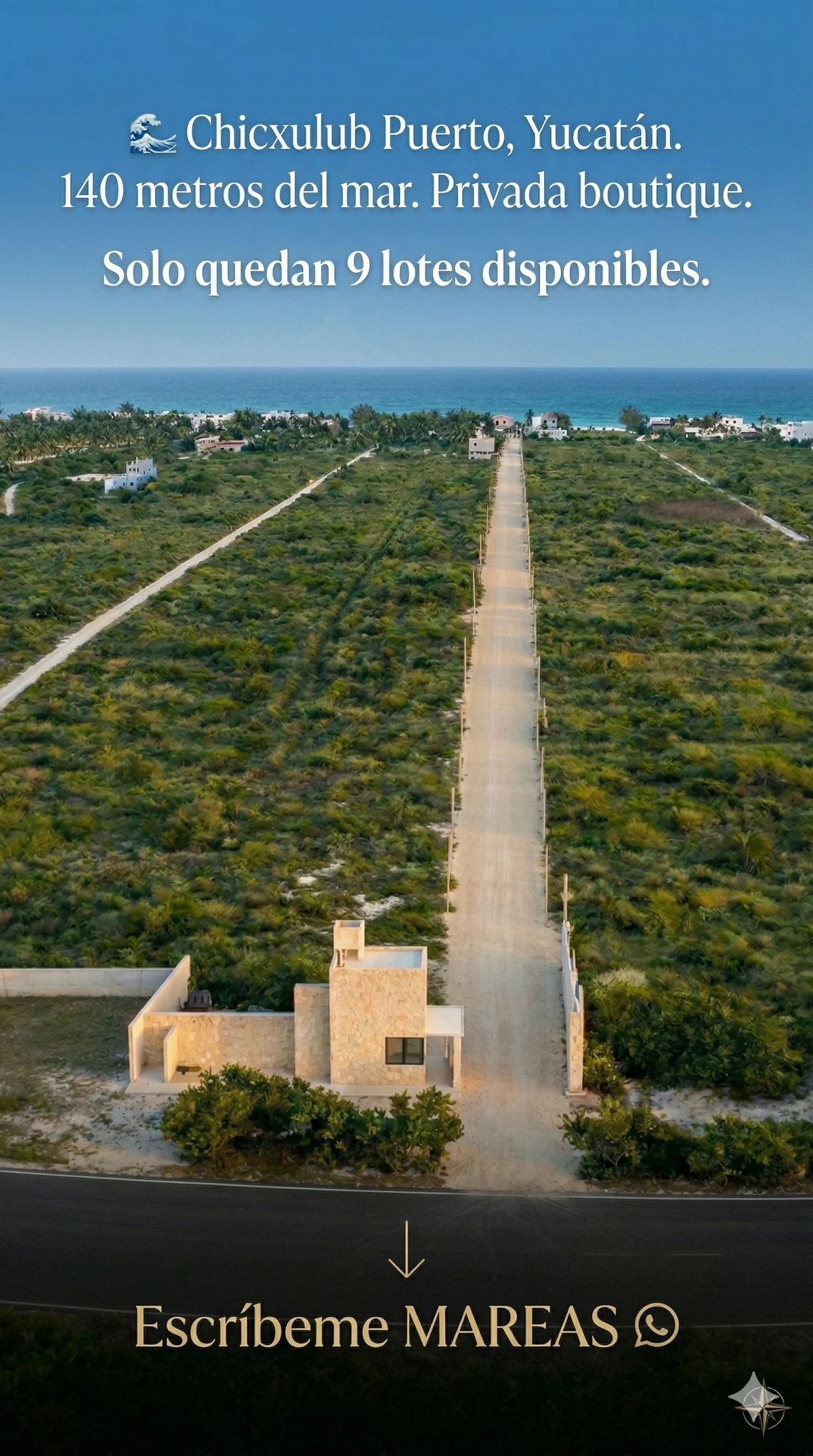 Aerial view of a beachfront property development in Chicxulub Puerto, Yucatan, showing a residential building and straight road through green land with ocean visible