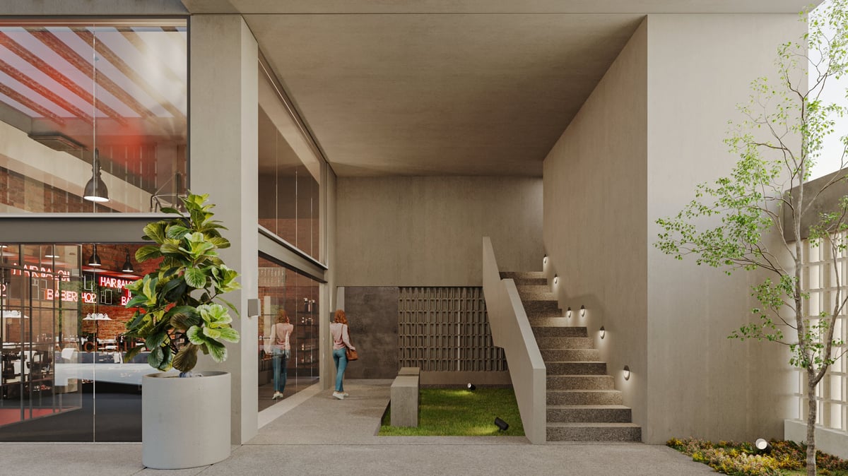 Modern interior mall space with retail storefront, indoor plants, staircase, and natural lighting from windows